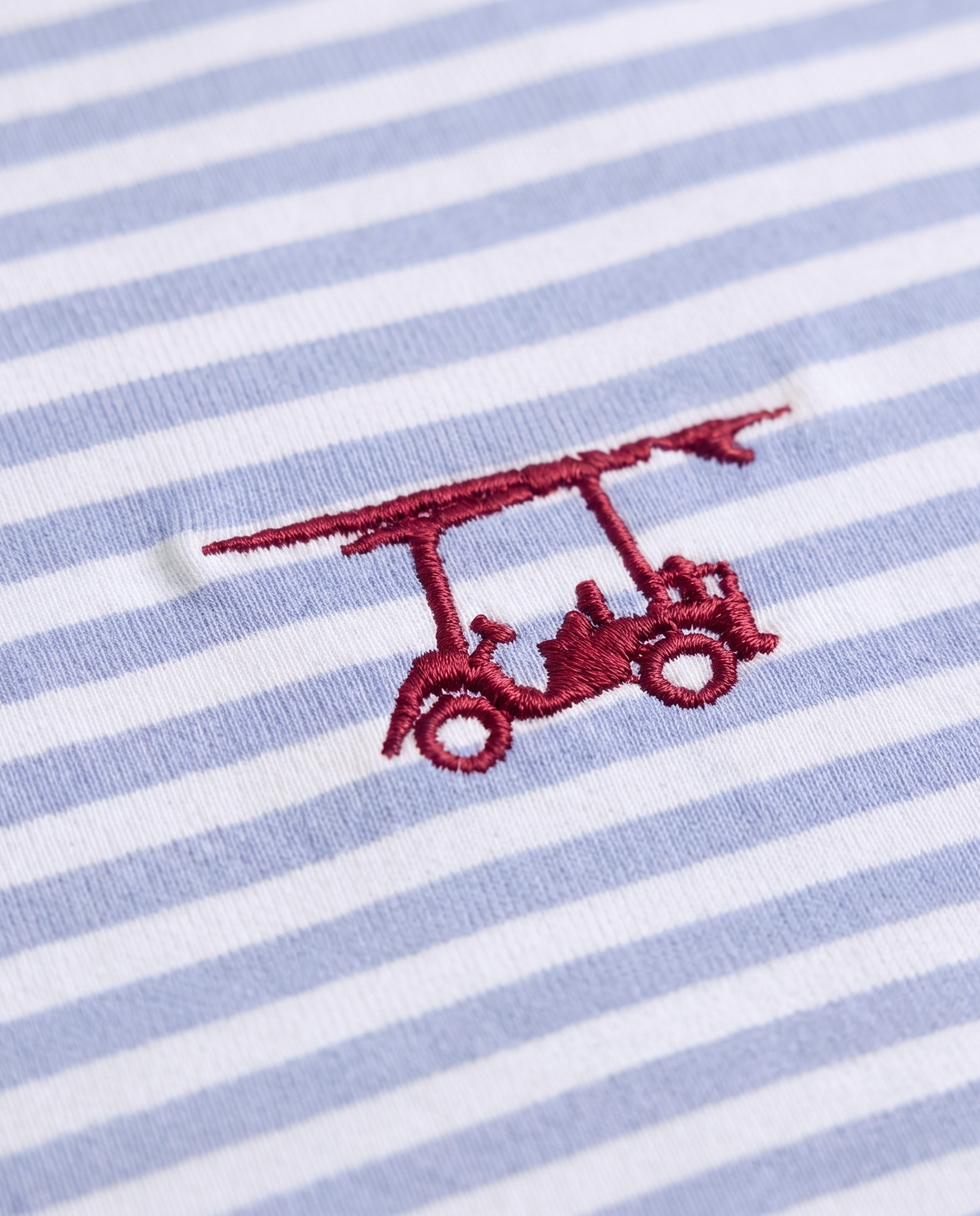 Albatross Polo Bell/White Feeder Stripe logo detail