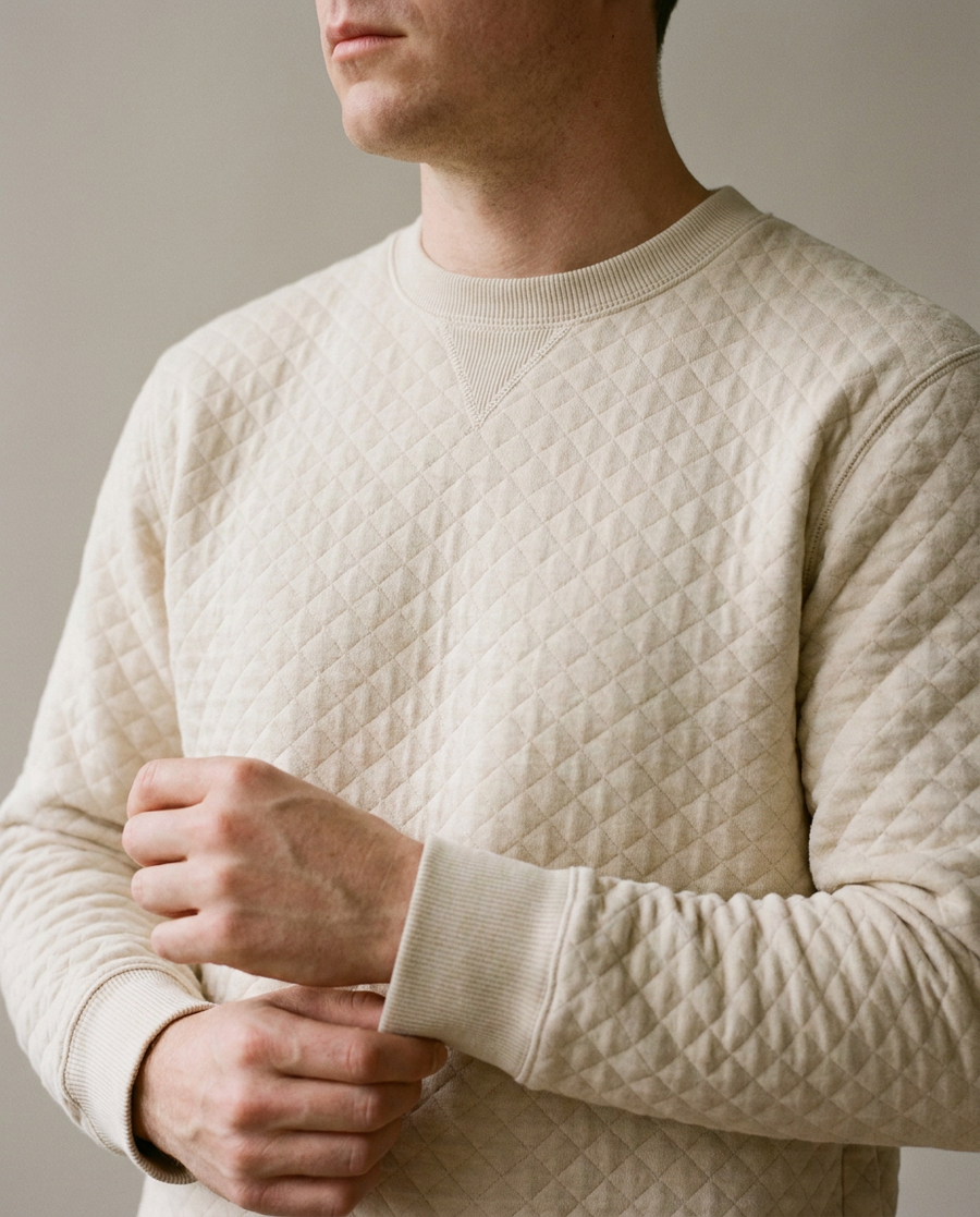 Close crop of the Sand Dollar Cape Crew Neck showing its diamond quilted texture